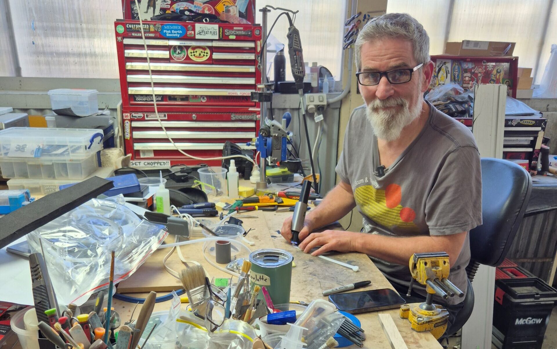 Tim McGaw at workshop desk